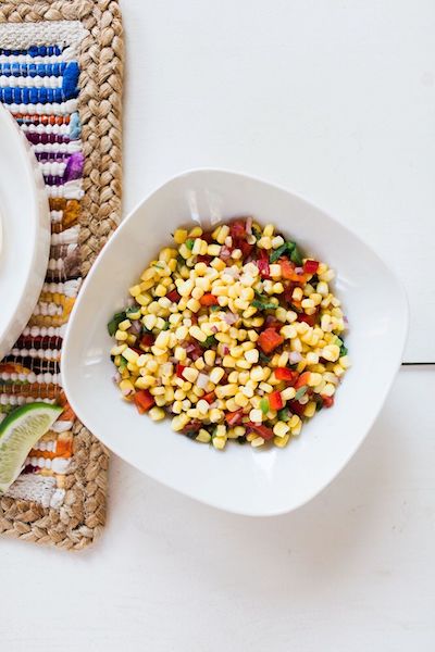 fresh corn salsa in white bowl for Cinco de Mayo menus ideas