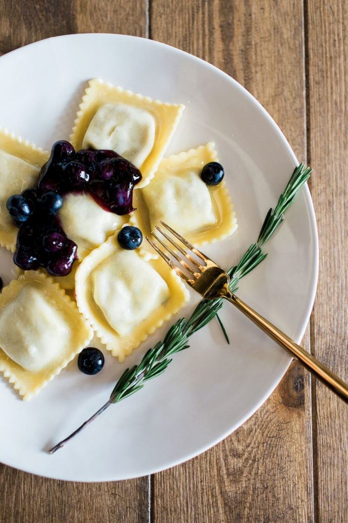 cheese raviolis with fresh local blueberry glaze with rosemary spring