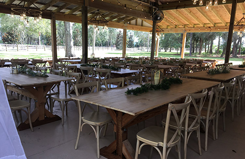 farmtable and french country chairs in reception space at Magnolia Manor